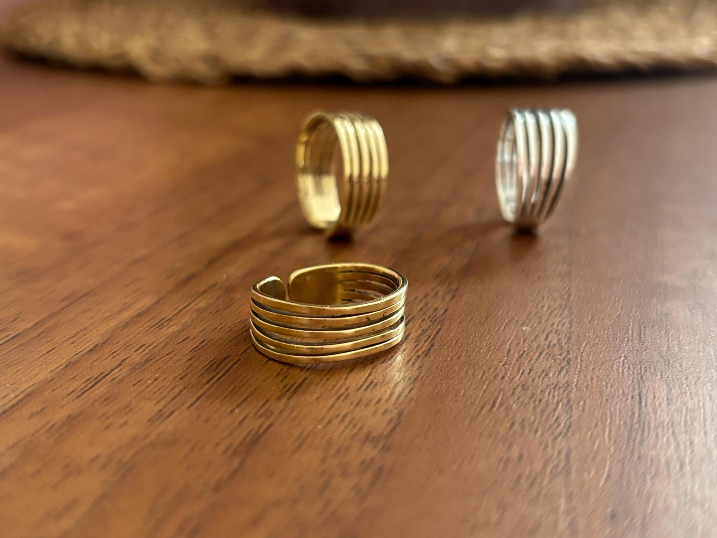 Adjustable textured brass wrap rings in gold and silver tones