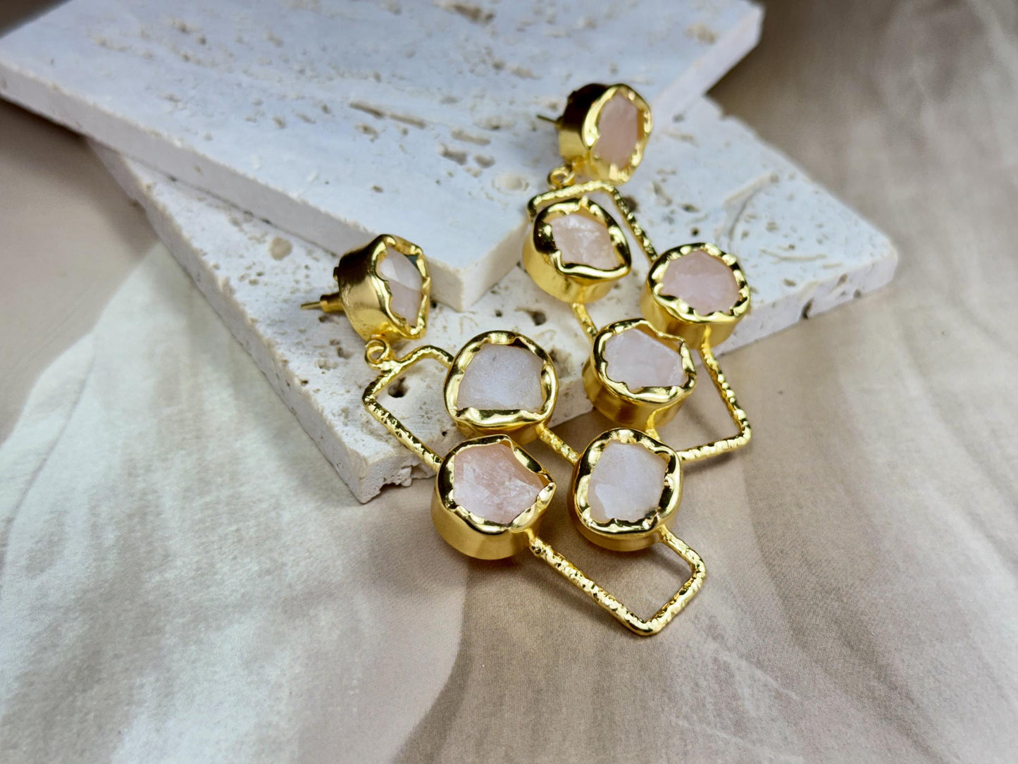Handcrafted Long Rose Quartz Dangle Earrings with Raw Gemstones Set in Textured Gold-Plated Frames.