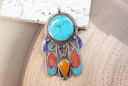 Silver Plated Tibetan Hamsa pendants.