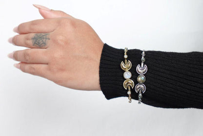 Double Moonstone Lunar Cuff Bracelet - Brass and silver cuffs with crescent moons and moonstones—mystical and chic.