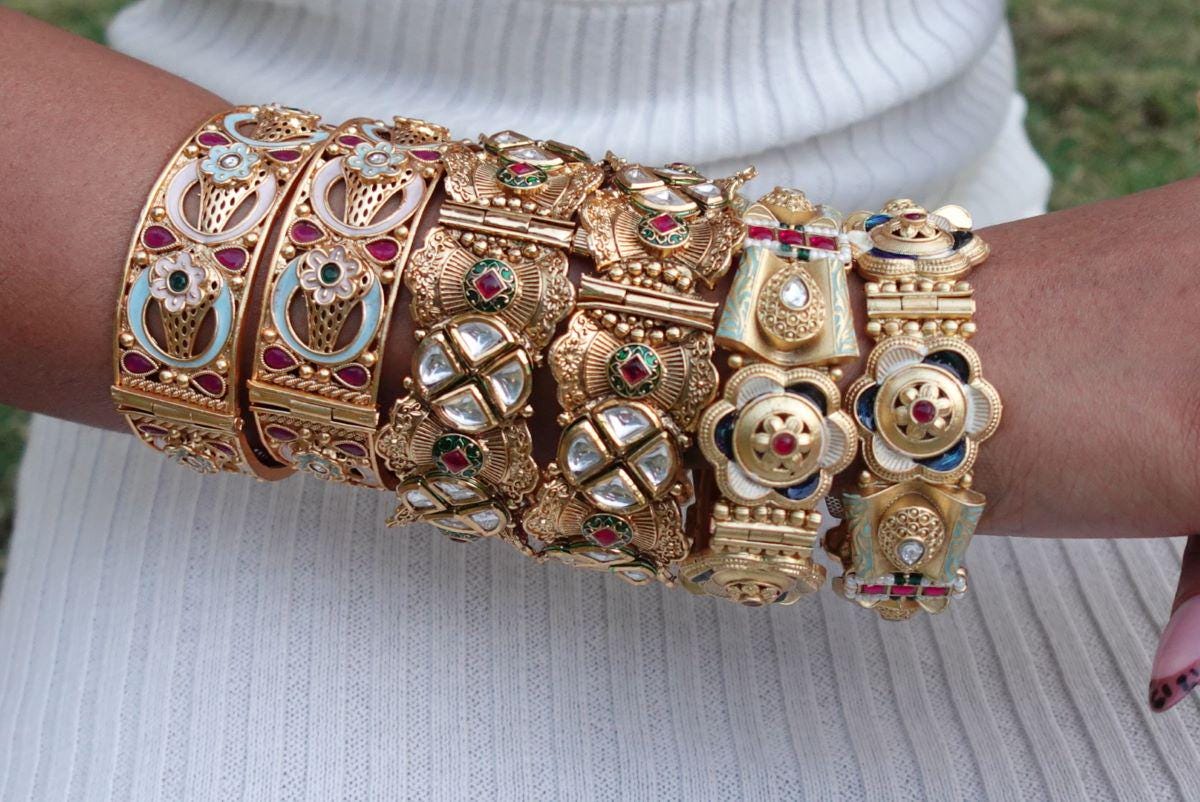 Pastel Floral Arch Kada - Unique pastel-toned openable kada with floral enamel work and teardrop rubies in oval layout..
