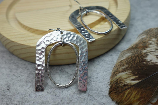 Hammered Horseshoe Brass Earrings - Statement earrings with a bold arch and hammered finish in gold-tone brass.