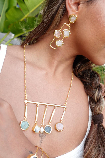 Handcrafted Long Rose Quartz Dangle Earrings with Raw Gemstones Set in Textured Gold-Plated Frames.