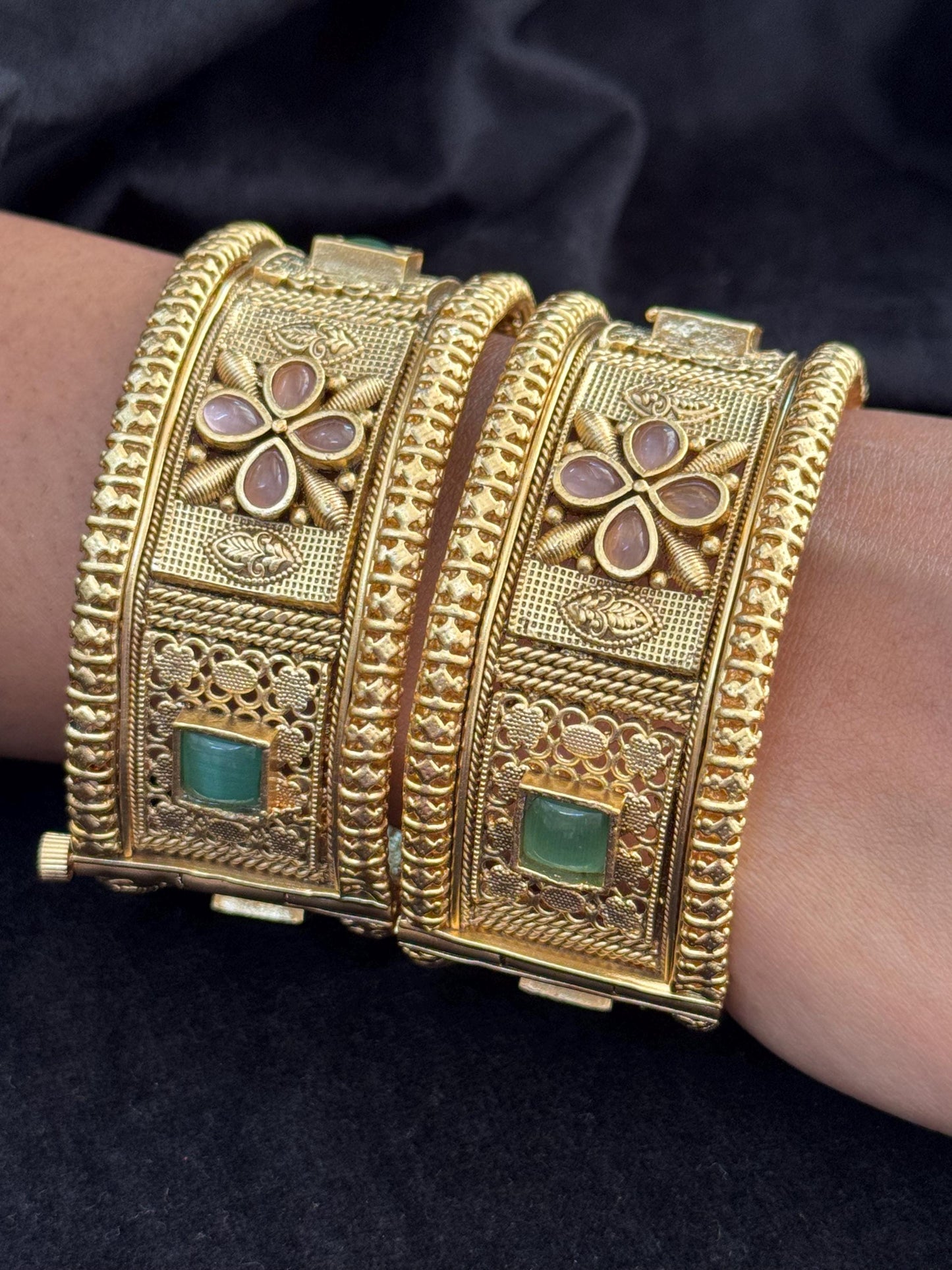 Emerald Bloom Rajwadi Kada - Gold polished bridal kada with floral pastel petal motifs and green square stones in embossed temple styling..