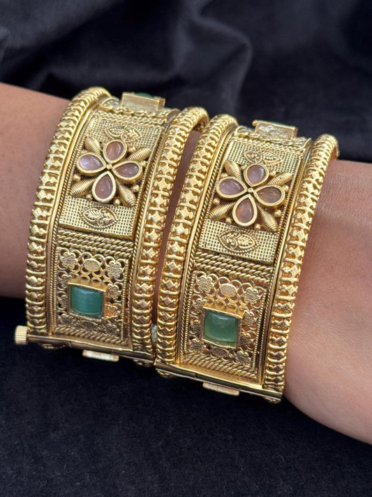 Emerald Bloom Rajwadi Kada - Gold polished bridal kada with floral pastel petal motifs and green square stones in embossed temple styling..