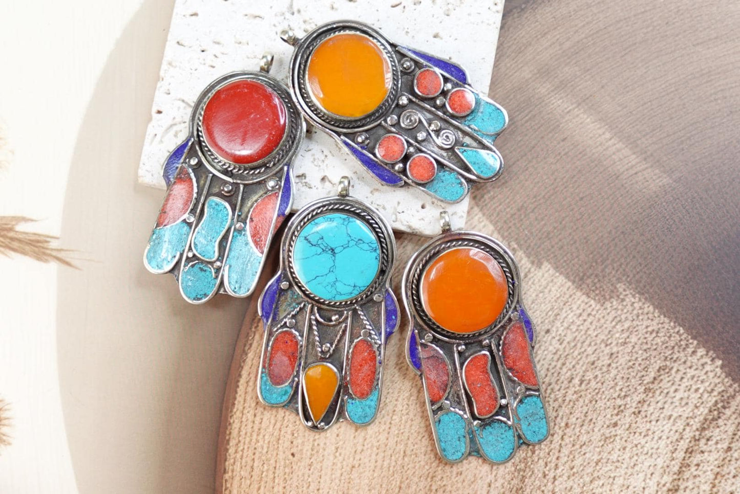 Silver Plated Tibetan Hamsa pendants.