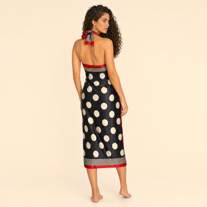 Polka Dot Satin Sarong — Riviera Drift, back view showing the open-back halter and red border