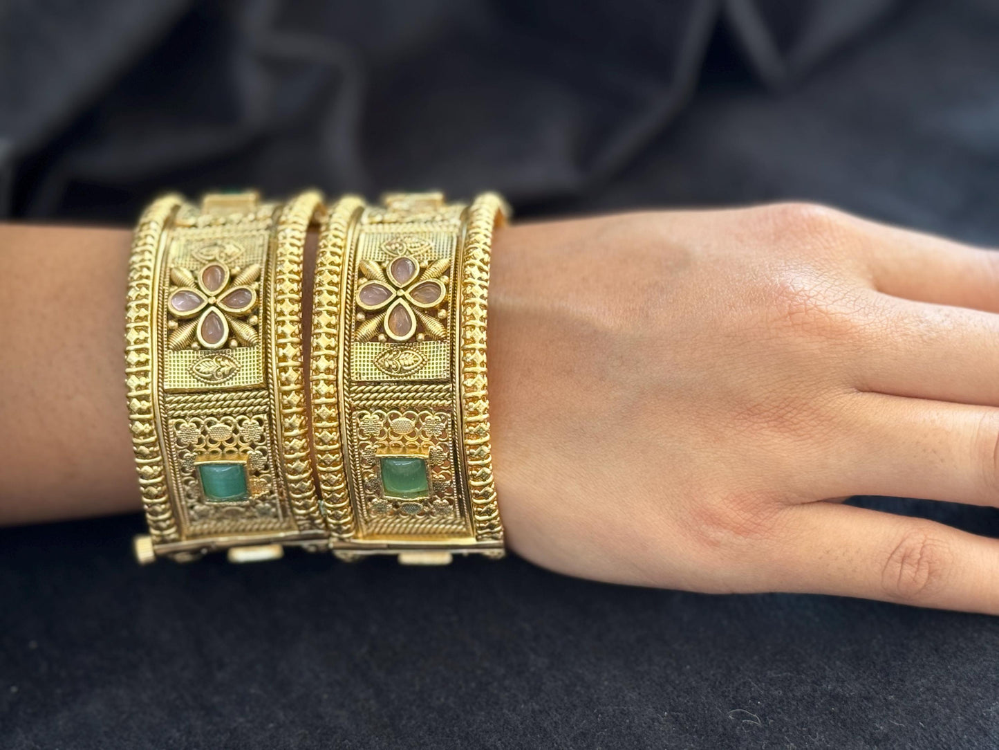 Emerald Bloom Rajwadi Kada - Gold polished bridal kada with floral pastel petal motifs and green square stones in embossed temple styling..