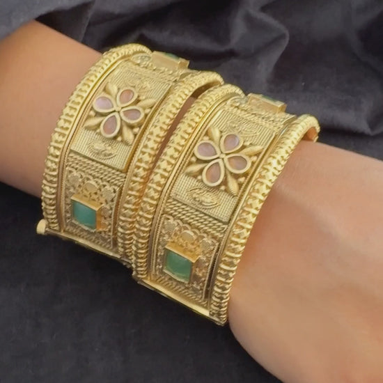 Emerald Bloom Rajwadi Kada - Gold polished bridal kada with floral pastel petal motifs and green square stones in embossed temple styling..