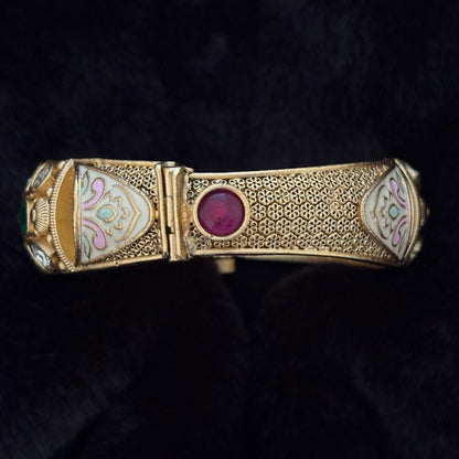 Close-up of crimson glass cabochon and screw-pin hinge on Kundan Meenakari Brass Kada Bangle